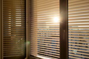 Sunlight coming through partially closed venetian blinds